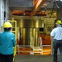 Turbine shaft. Below it, the Francis turbine, each rotor around 300t.  Above it, the electrical generators. This is Unit 9.