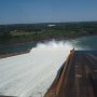Riding on top of the dam.
